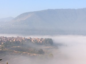 Early morning mists over nearby Khokana, one of the oldest Newari towns in the Kathmandu Valley