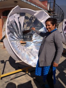 Pushpa used some of her CNN award money to buy solar inverters as well as this solar broiler where she is cooking beans. (copyright Donatella Lorch)