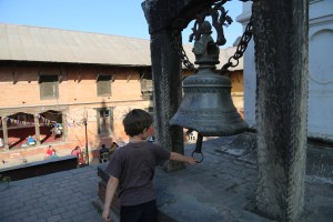 Waking Lord Shiva by ringing the bell in Mother Teresa's hospice (copyright Donatella Lorch)