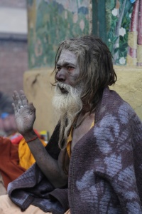 One Sadhu sat shivering covered only by a blanket. © Donatella Lorch