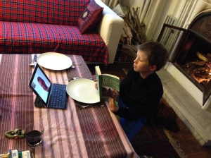 Lucas reading "Roman Mysteries" to John on FaceTime just before dinner in Kathmandu. © Donatella Lorch