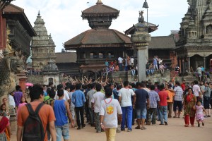 Festival celebrants parade through Bakhtapur Durbar Square. © Donatella Lorch