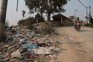 Open dumping is ubiquitous. Nepalis dump their garbage on roadsides, along river banks and when the pile grows they light the plastic bags covering neighborhood is carcinogenic dioxin. ©Donatella Lorch