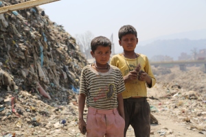 Young boys scavenge for copper wires in the mountain of refuse dredged from the Bagmati River. © Donatella Lorch