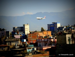 Planes landing at TIA skim Kathmandu rooftops. © Donatella Lorch