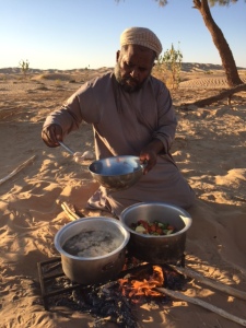 Bakhit cooking the evening meal. © Donatella Lorch